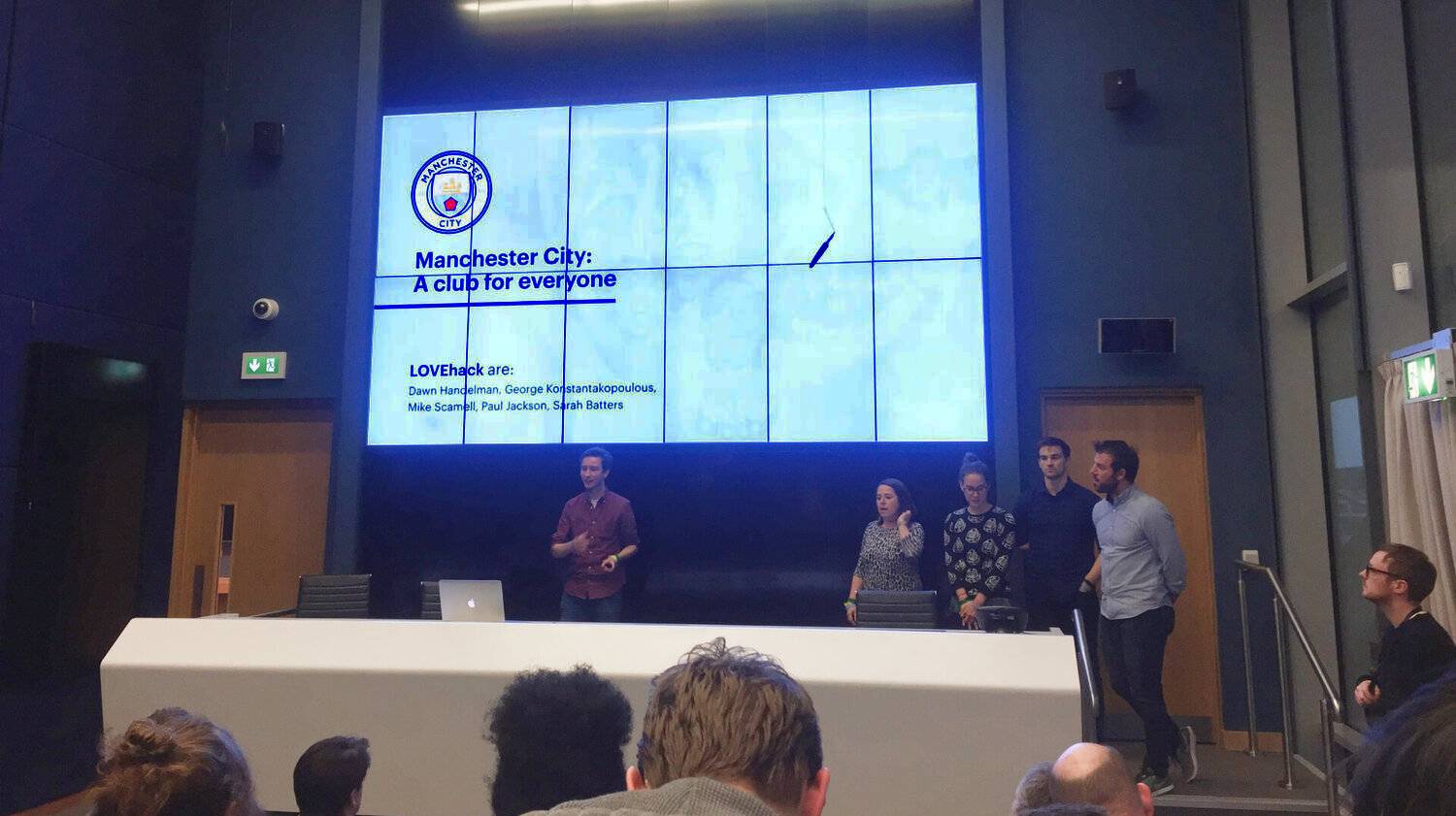 Myself stood in front of our presentation in the Manchester City Press Room